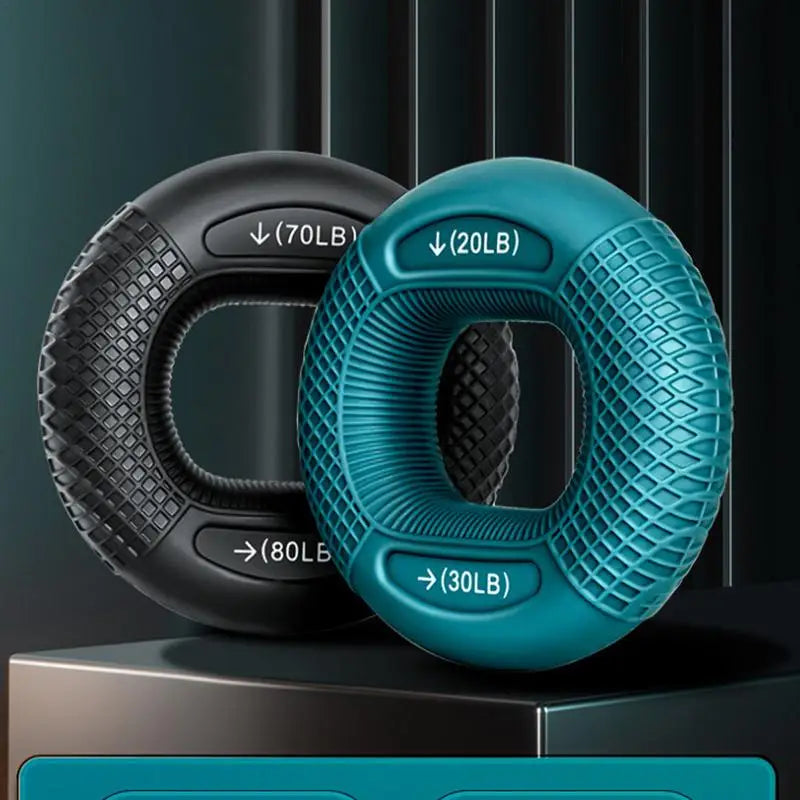 Two resistance rings, one black and one blue, with weight indicators on a dark background.