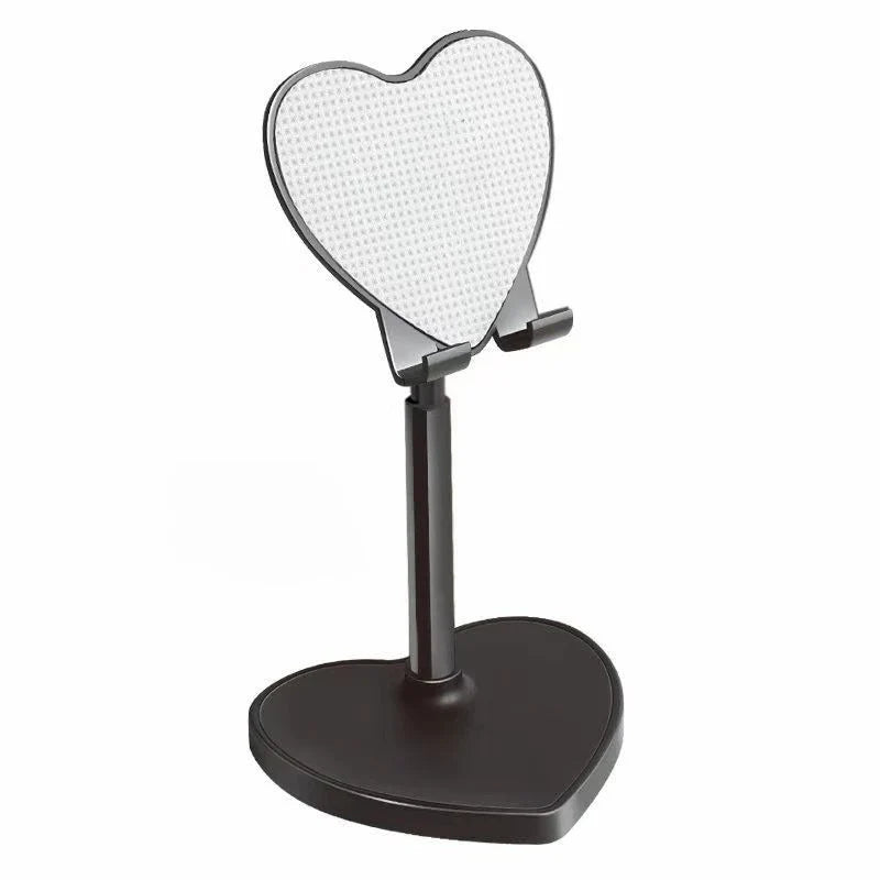 Heart-shaped black phone stand on a white background
