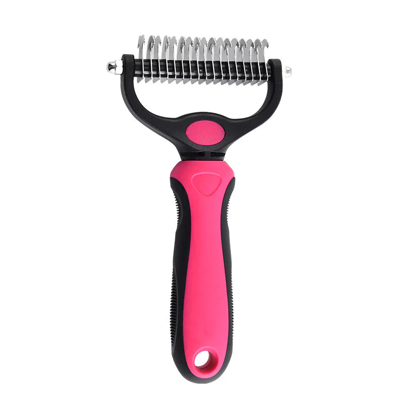 Pet grooming brush with pink handle and metal bristles on a white background
