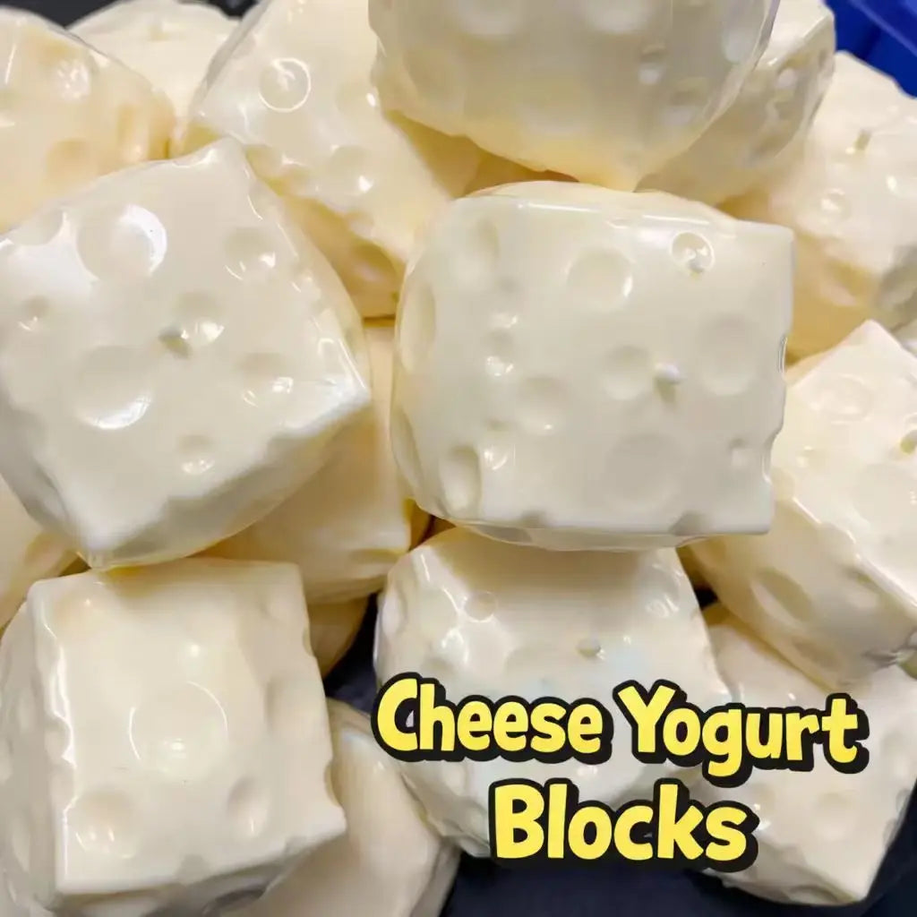 Close-up of moldable cheese blocks with text overlay